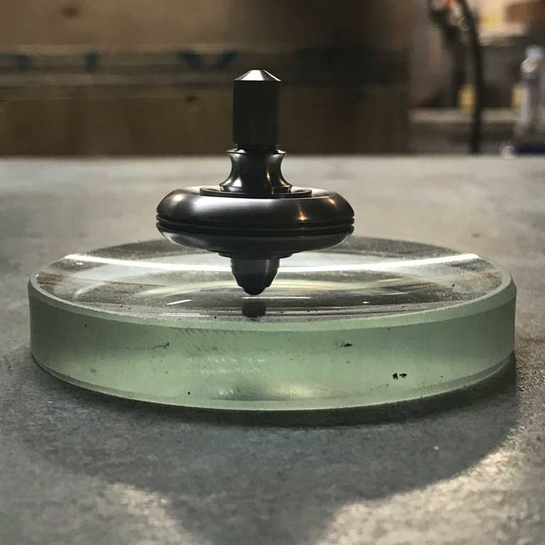 An elegantly carved spinning top.